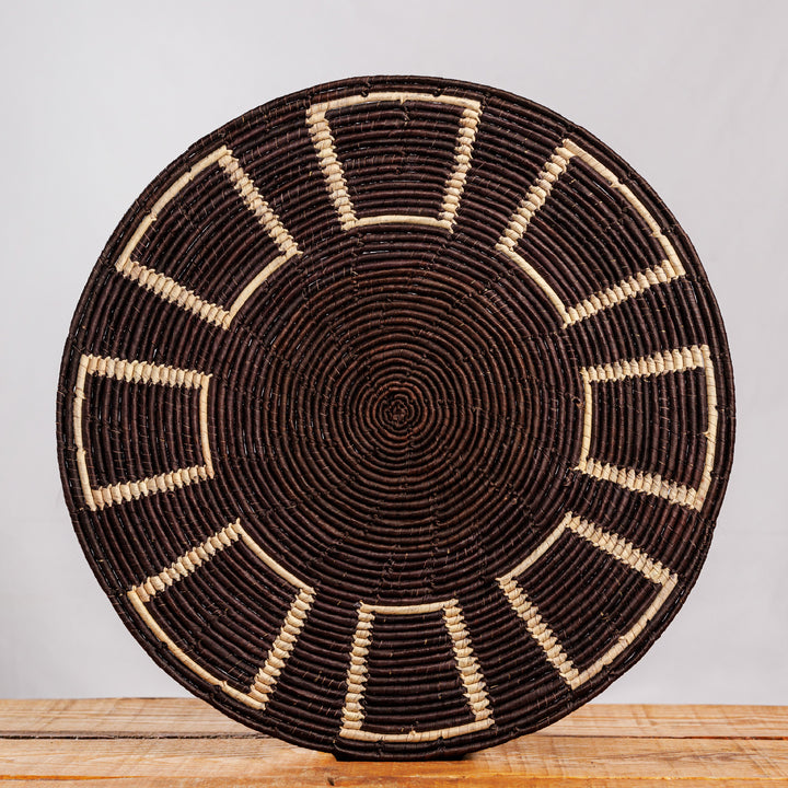 Black Obstract Hand Woven Mat, 14-inch Diameter and 0.1-inch Depth.