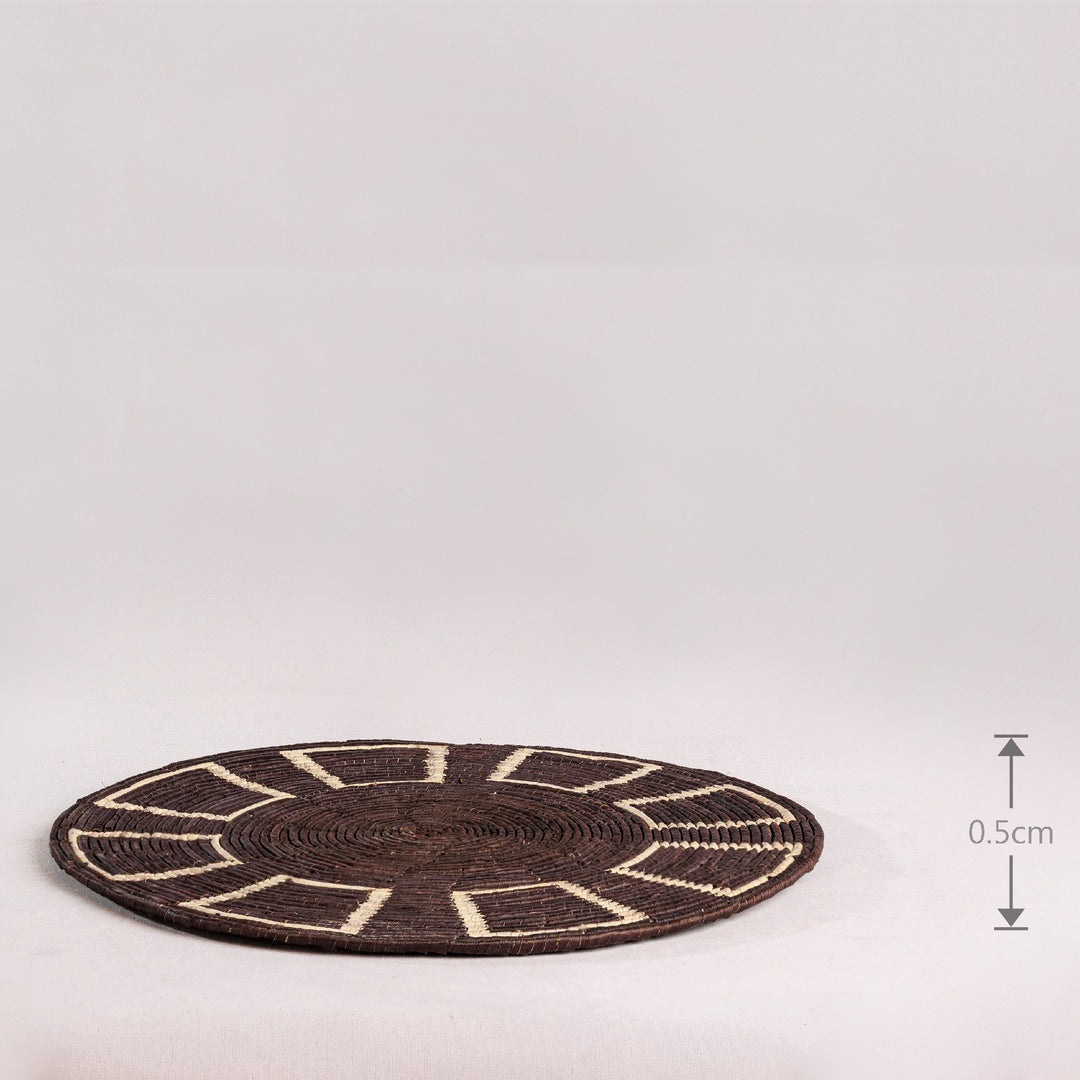 Black Obstract Hand Woven Mat, 14-inch Diameter and 0.1-inch Depth.