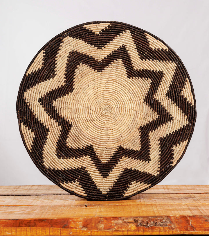 Eight Pyramid Black Hand-Woven Mat, 14-inch Diameter and 0.2-inch Depth.